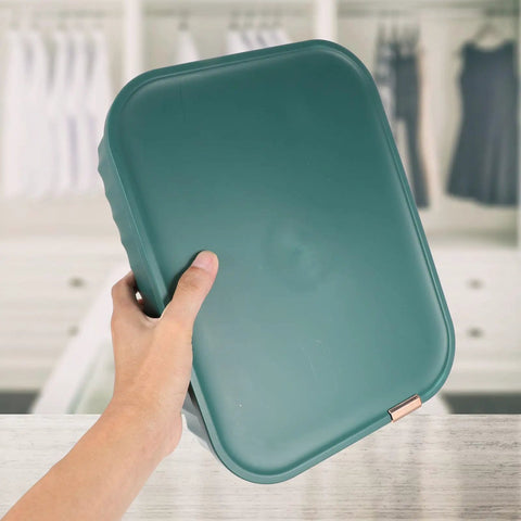 Hand holding a Heavy Duty Underwear Storage Box With Secure Lid, durable plastic organizer for socks and sleepwear.