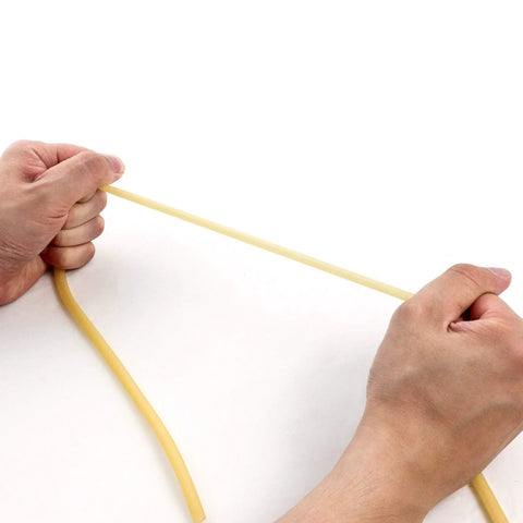 QWORK latex rubber tubing, 1/4 in OD, 3/16 in ID, natural yellow, being stretched by hands