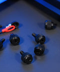 Close-up of 24 Pack Computer Case Thumb Screws 6-32 Thread M3.5x6 Knurled Black Fasteners on a desk