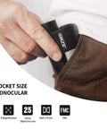 Person placing Dope Pocket 8x25 Monocular For Adults And Kids With Close Focus 1 Ft Fully Multicoated Optics And BAK4 Prism in pocket.