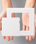 Slick Self Adhesive Access Panel For Hiding Drywall Gaps Concealed Ceiling Door held in hands, showcasing white 3x3 inch plastic design.