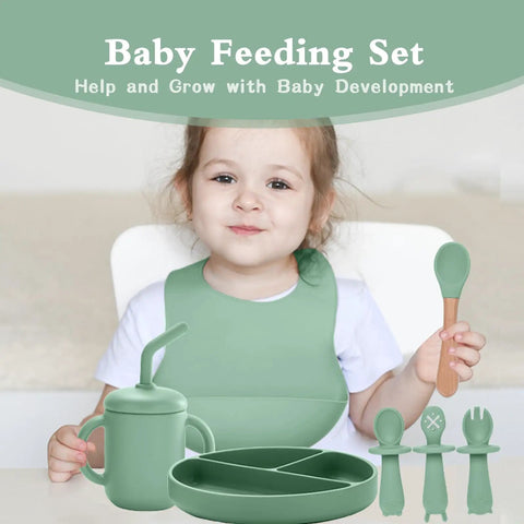 Child using Ultra Safe Silicone Baby Feeding Set 13 Piece With Suction Bowl And Plate Spoons And Forks Bib And Cup Baby Toothbrush.
