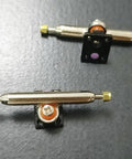 10 Sets Pro Fingerboard Truck Bushings Orange And White PU Material Fits All Pro Fingerboard Trucks Random Colors Durable And Stiffer Than Standard Bushings For Dope Smooth Turns And Precise Grips, showing bushings attached to pro trucks.