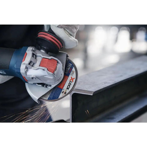 Close-up of Street Tough 4.5 Inch Angle Grinder Featuring X Lock Tool Free Disc Swap Mount cutting metal with sparks.