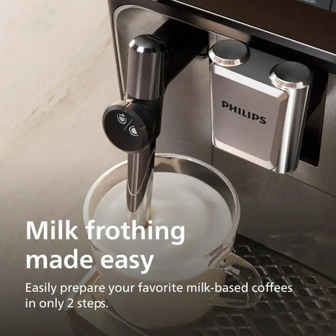 Fully Automatic Espresso Machine With One Touch Milk Frother And Quiet Ceramic Grinder crafts milk froth in a glass cup.