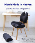 Office chair with black ergonomic back cushion and under desk foot rest.