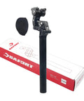 Suspension Seatpost With 4 Link Parallelogram System And Hard Or Soft Micro Adjustment For Road Gravel MTB And E Bikes 27.2 To 33.9mm Fit Delivers Ultra Smooth Ride And All Day Comfort On Every Ride next to packaging.