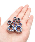 Heavy Duty 20 Pack M6 Nylon Lock Nuts Solid As A Rock 304 Stainless Steel Hex Fasteners on a hand, showing different sizes.