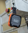 Rugged Bluetooth Speaker With Magnetic Strip And Hook, Rechargeable, attached to industrial equipment, showcasing durability for jobsites.