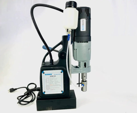 Black 60mm Magnetic Drill With Rock Solid 52 Lb Base Two Speed Reversible Motor Heavy Duty Steel Working Beast Built Tough For Tough Jobs Includes Mt3 Arbor And Quick Change Adapters Straight Shooting Power Delivery with attached motor and stronghold base.