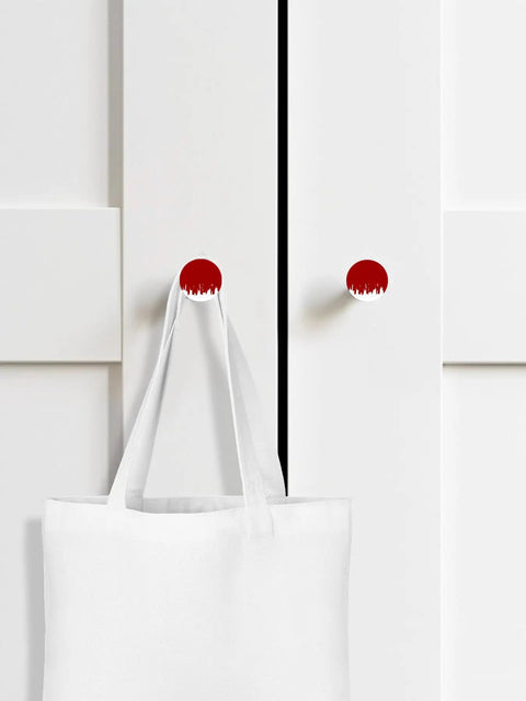 Top Tier Beech Wood Cabinet Knobs Round Drawer Pulls One Point Four Inch Abstract Graffiti Vibe Red And White Painted furniture hardware on white cupboard with tote bag.