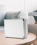 Tough As Nails Aluminum Tool Chest With Comfortable Grip Handle And Solid Metal Latch Portable Hard Storage Case For Go Everywhere Outdoor Excursions And Projects on a table.