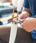Technician installing 5 Pcs Flare Connector Set For Three Eighths Inch SAE 45 Degree Brass Pipe Fittings for air conditioner.