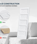 White 30x84 Inch Sliding Barn Door With 5.5 Ft Hardware Kit Included Solid MDF Slab With Waterproof Scratch Resistant PVC Surface DIY Easy Install Space Saving 5 Panel Door For Home And Apartment Renovations shown leaning on a white geometric shape.