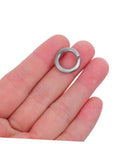 Heavy Duty Stainless Steel Split Lock Washer held in hand, suitable for nuts and bolts tightening tasks.