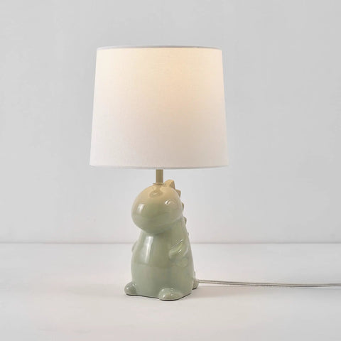 Tommy Dinosaur 16 Inch Ceramic Table Lamp In Green With White Cotton Shade Kid Friendly Nightstand Light For Kids Room Whimsical Decor Durable Ceramic Base And Soft Diffused Glow
