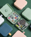 Travel Size Sewing Kit With Compact Blue Storage Box, Beginner Friendly DIY Embroidery Thread And Needle Accessories shown open with threads and tools.