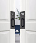 Two Sets 12 Inch Stainless Steel Door Handles For Wall Mounted Push Pull Plates With Screws, Rust Resistant And Durable Black Finish installed on white doors