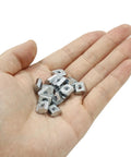 Hand holding 50Pcs 2020 Series Sliding T Nuts Carbon Steel M4 T Slot Nut Hammer Head M3 T sliding nuts for aluminum profiles, nickel plated