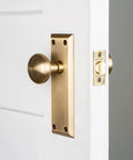 New York Plate And Homestead Door Knob Set With Oval Knob And Long Back Plate In Dope Finishes For A Classic Vintage Look