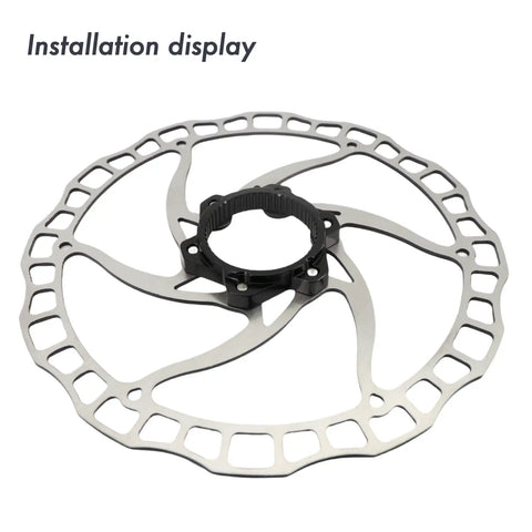 Installation display of Centerlock To Six Bolt Rotor Adapter With Lockring All In One Kit for MTB and Road Bikes in black.