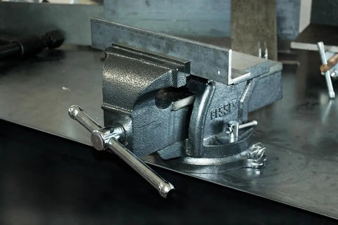 Heavy Duty 6 Inch Bench Vise With 36 Degree Swivel Base Hardened Serrated Jaws Built In Anvil And 6 Inch Jaw Opening Three Mounting Holes For Stability