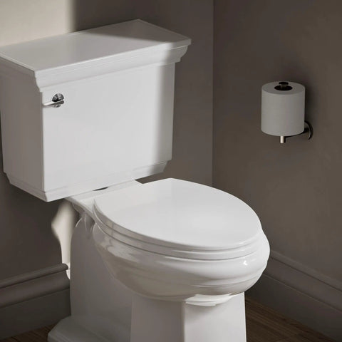 Heavy Duty Elongated White Toilet Seat Featuring Quick Release Hinges And Grip Tight Bumpers For Dead Simple Mounting And Super Fast Cleaning Upgrades Your Bathroom Setup Today next to clean toilet and toilet paper holder.