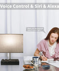 Color Changing Smart Lamp For Bedroom With App Control And WiFi Alexa Support beside person writing at desk