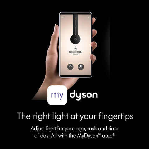 Smartphone showing lighting app interface with MyDyson app, adjusting light for age, task, and time, held by a hand.