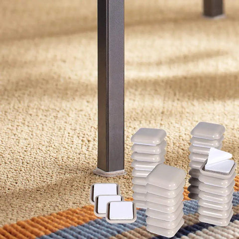 Combo Pack Self Adhesive Furniture Sliders For Carpet And Hardwood Floors 32 One Inch Square Gliders visible next to table leg