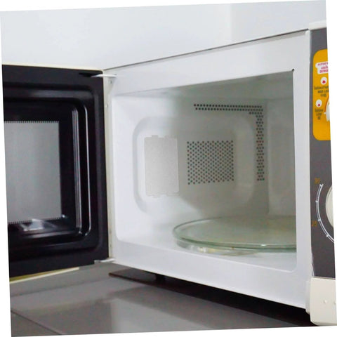 Open microwave oven showing installed 10 Piece Microwave Mica Insulation Sheets For Easy To Cut To Fit No Fuss Heat Resistant