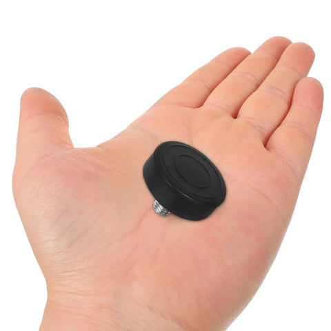 12 Piece Adjustable Furniture Leveling Feet With M10 Screw Thread held in hand, showcasing grippy rubber pad and compact size.