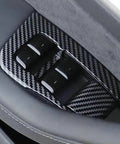 Close-up of Clean 11 Piece Interior Window Switch Covers And Door Control Button Trim Kit For Tesla Model 3 and Model Y 2017 to 2023.