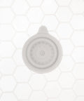 Premium Soft Silicone Bathtub Drain Stopper With Super Strong Suction Cup Locks Water In Fast For Baby Bath Times Easy Peel Grip Gray Tub Plug on white hexagon tiles.