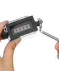 Hands showing 5 Digit Mechanical Bale Counter For Baler D67F With Pull Counter, screw fixation, lightweight design
