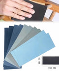 Get Your Hands On 50 Pieces Of Premium Wet Dry Silicon Carbide Sandpaper Sheets With Assorted Grits Perfect For Woodworking And Auto Detailing Projects That Need Serious Power And Smooth Finish Results Today, showing hand using sandpaper.