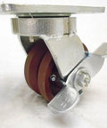 4 Inch Swivel Caster With Burgundy Ductile Steel Wheel And 7/8 Inch V Groove Offers 1500 Lbs Capacity, side view with locking brake.
