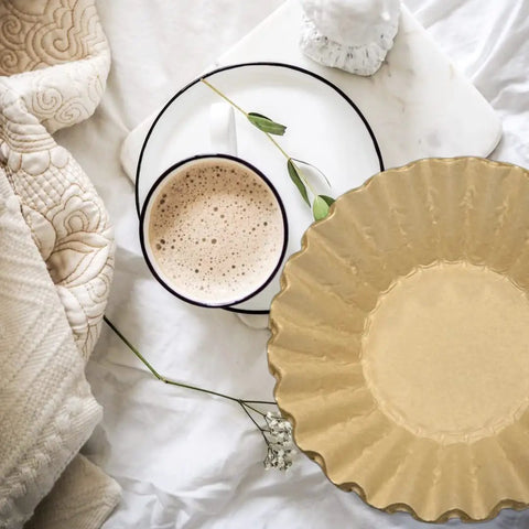 Natural Unbleached Brown Biodegradable Extra Large Coffee Filters For 10 To 15 Cup Baskets, shown with coffee cup on white fabric