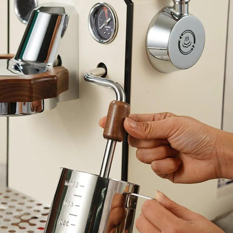 Barista hand using Solid Wood Anti Scald Guard For GemiLai 3145 Brew Head And 3006 Steam Knob on coffee machine.