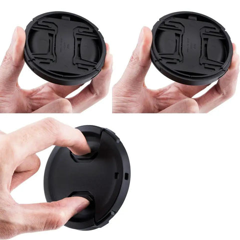 Two-Pack 49mm Front Lens Cap With Keeper For Canon R100 R50 R10, illustrated in hand, showcasing center-pinch design.