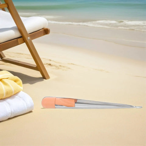 Rugged Heavy Duty Marine Rope Splicing Spike With Ergonomic Handle And Stainless Steel Wire Threading Tool 280mm Long Built For Tough Boat Tasks And Navigation With Sturdy Plastic Grip. Stainless steel spike on beach sand near chair
