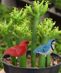 Simulated Bird Shaped Soil Moisture Sensor With Automatic Alarm in garden pot with green plants