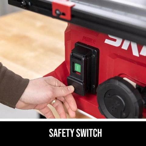 Close-up of the safety switch on the Built Tough 15 Amp 8 1/4 Inch Compact Table Saw With Quick Release Folding Stand.