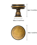 10 Pack Brushed Antique Brass Kitchen Cabinet Knobs Zinc Cabinet Hardware For Dresser Drawers Solid Metal Rust Proof Anti Corrosion Non Toxic 1.2 Inch Diameter 1.1 Inch Height Includes 1 Inch Screws. Side and top view of antique brass cabinet knob with size dimensions.