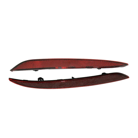 Sleek Red Rear Bumper Reflectors For Tesla Model 3 2017 Through 2022 Clean Lines Left And Right Turn Markers Replace Lens Trim Oem 1077406-00-F And 1077407-00-F viewed from above, showcasing shiny red plastic with detailed surface texture.