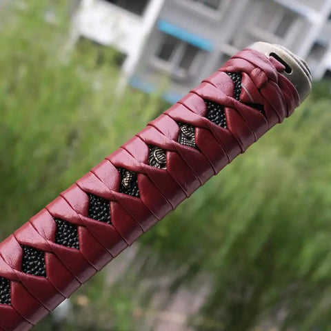 Close-up of red wrapped Dope Japanese Samurai Katana Tsuka Handle Ten Point Two Inch DIY Replacement With Alloy Copper Iron Fittings