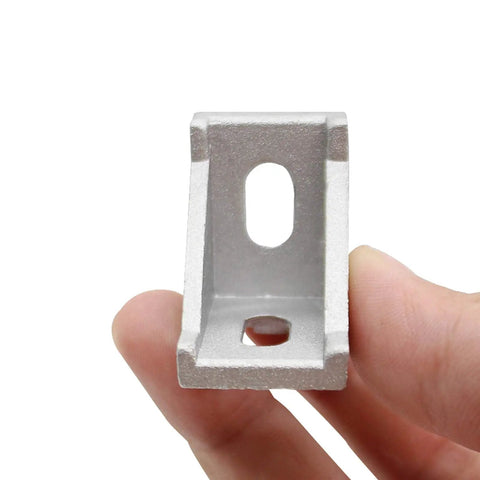 Close-up of a 90-degree aluminum extrusion corner bracket for 1.5 inch profile rails, part of 20 Sets Of 1.5 Inch Aluminum Extrusion Corner Brackets With T Nuts And Bolts, Built To Last For 3D Printers, CNC Routers, And Robotic Frames.