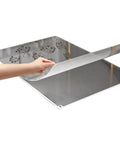 Heavy Duty 300 Sheet Adhesive Tacky Mats For Sweeping Dust Dirt And Grit Off Boots And Equipment Wheels Quick Peel Replacement Layers being peeled.