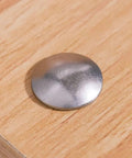 Stainless Steel Carriage Bolt Kit 1/4-20 x 2 Inch with round head installed on wood surface