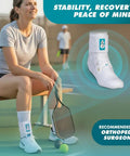 Person wearing ASO Ankle Stabilizer Lace Up Brace For Sprained Ankle And Peroneal Tendonitis Orthopedic Support, sitting on a bench